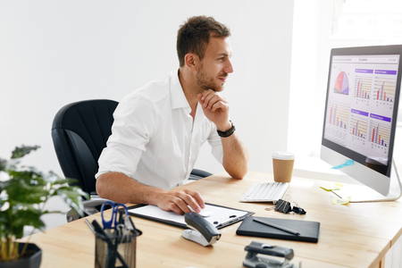 business-man-working-on-computer-in-office